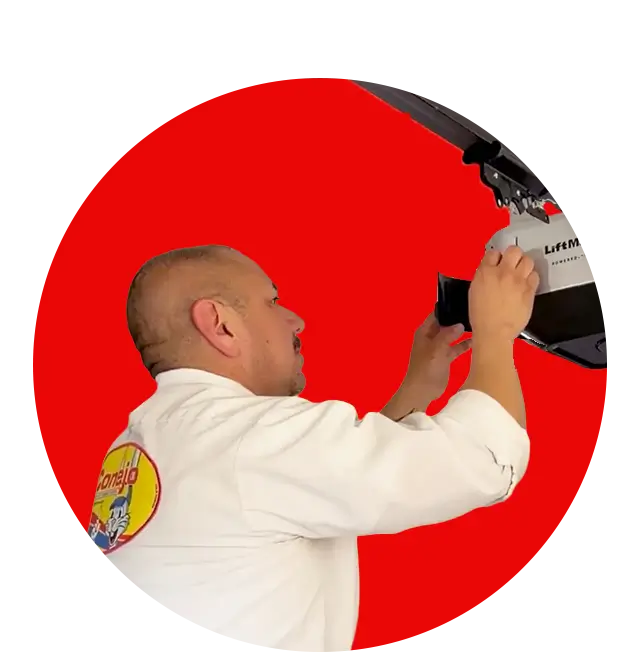 Service technician performing garage door maintenance