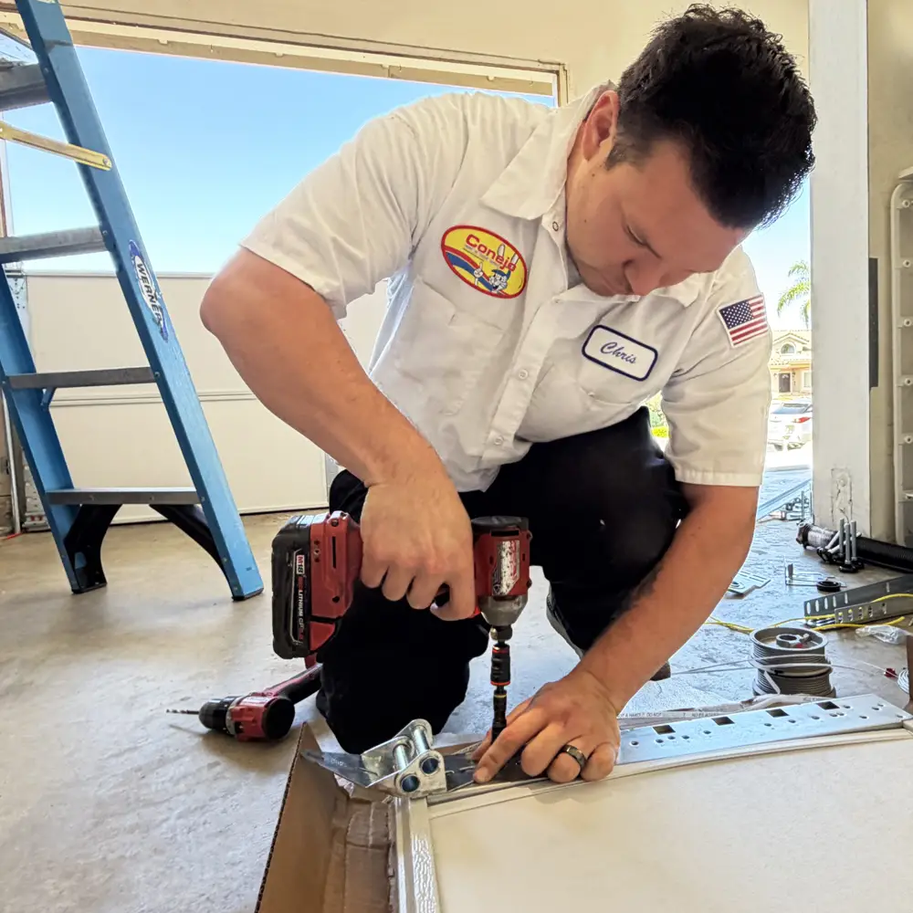 Conejo Services technician completing a garage door installation