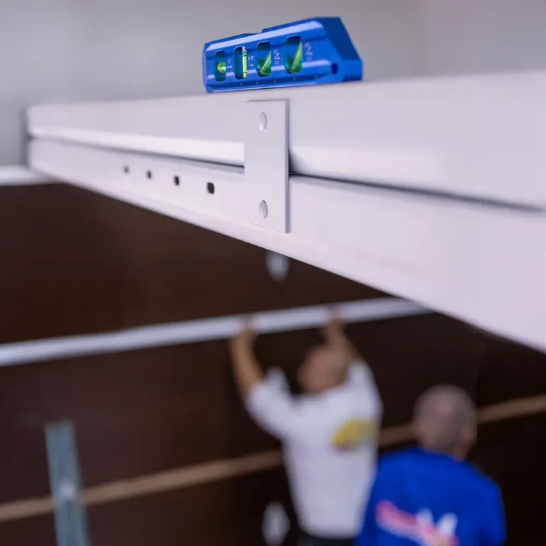 Using a level to ensure accurate garage door installation