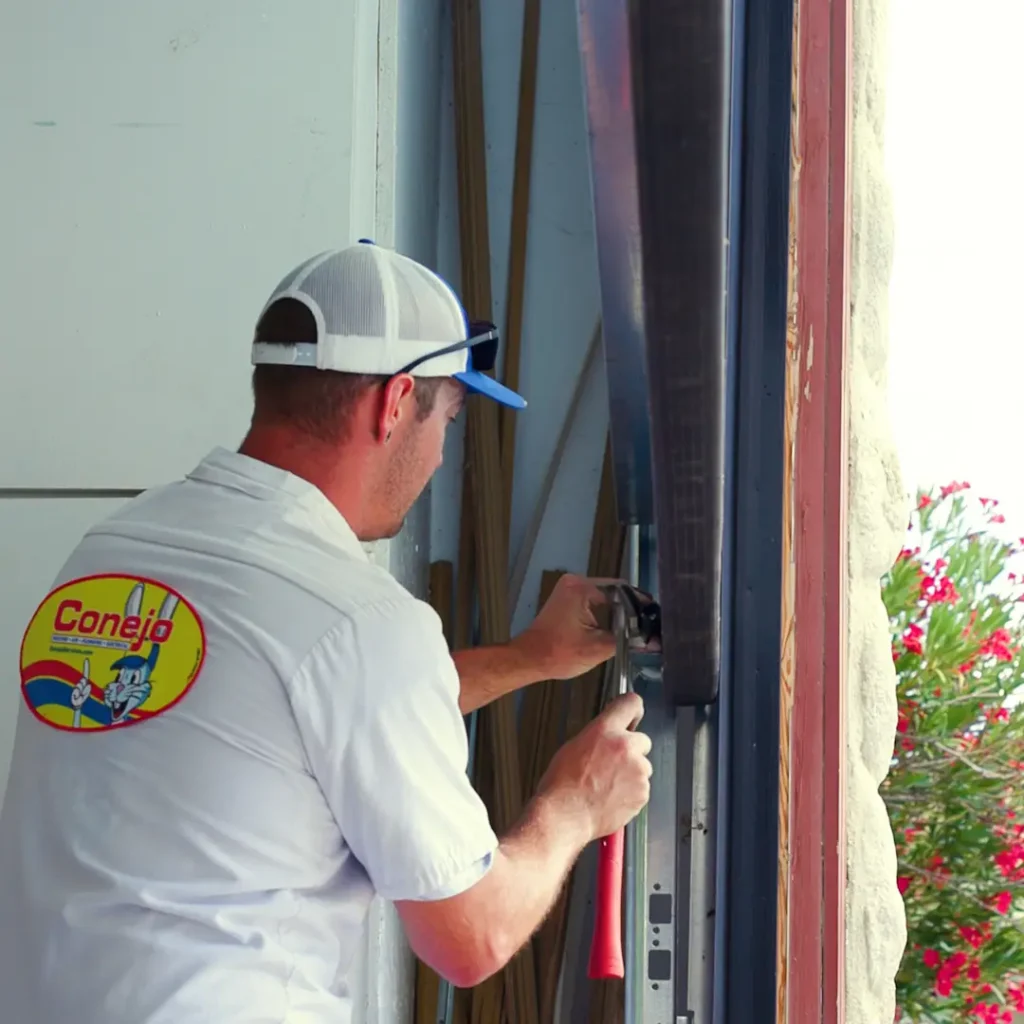 Conejo Services garage door technician installing rollers